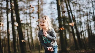 Child in leaves